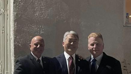 Asm. Muratsuchi with two others in front of the Dalmatian American Club of San Pedro