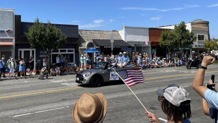 Street parade with car driving by