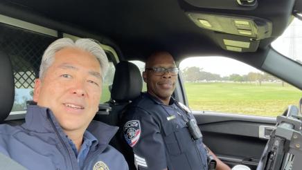 Asm. Muratsuchi with Sgt. Ron Salary inside of squad car