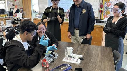 Asm. Muratsuchi views students performing lab experiment