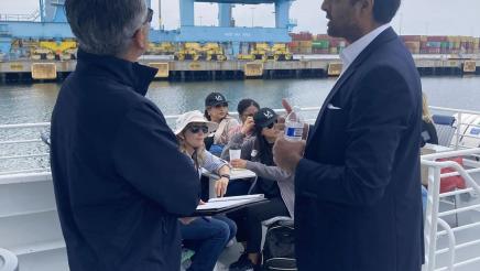 Asm. Muratsuchi speaking with Avin Sharma while examining port infrastructure