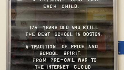 School history and info described on a letter board within a glass case