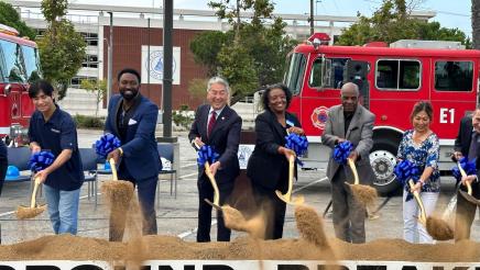 Asm. Muratsuchi and others moving dirt with shovels during ceremony
