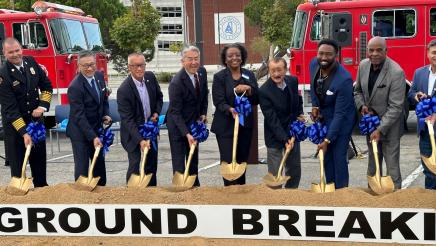 Asm. Muratsuchi and others holding shovels, scooping up dirt during ceremony