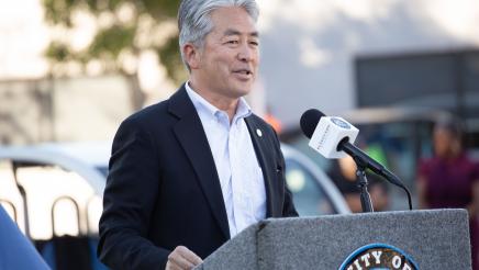 Asm. Muratsuchi at podium, speaking