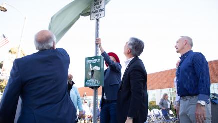 EV Golf cart parking sign being unveiled