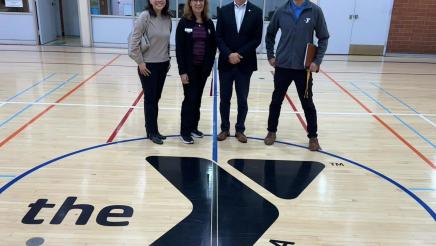 Asm. Muratsuchi and wife on basketball court with YMCA staffers