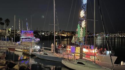 Boats docked, doecrated with Christmas lights