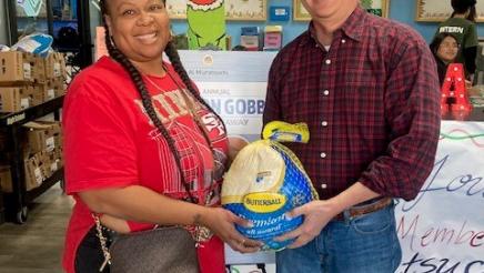 Asm. Muratsuchi with constituent receiving turkey
