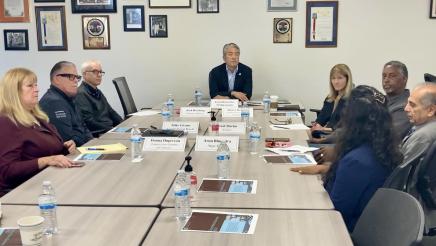 Asm. Muratsuchi and others sitting at table, in discussion
