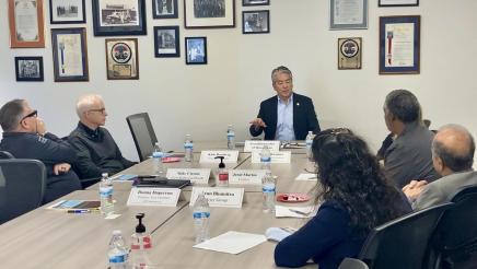Asm. Muratsuchi and others sitting at table, in discussion