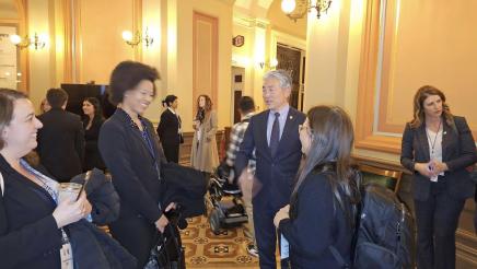 Asm. Muratsuchi greets students and staff in a hallway at the State Capitol