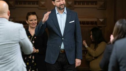 Pres. Goldbergbeing welcomed to the Assembly Floor