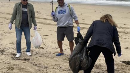 Asm. Muratsuchi and two volunteers picking up trash on beach