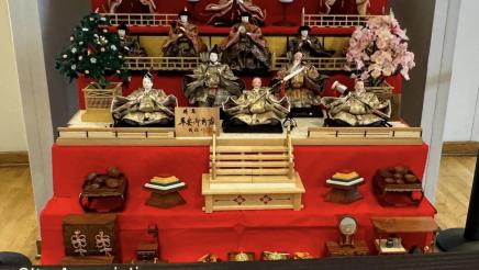 Statues and figurines assembled on tiered table