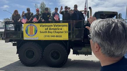 Asm. Muratsuchi waving to riders on the Vietnam Veterans of America truck