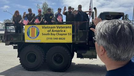Asm. Muratsuchi waving to riders on the Vietnam Veterans of America truck