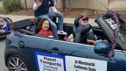 Asm. Muratsuchi and Hazel Taniguchi sitting in their parade car