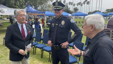 Asm. Muratsuchi speaking with two law enforcement officers