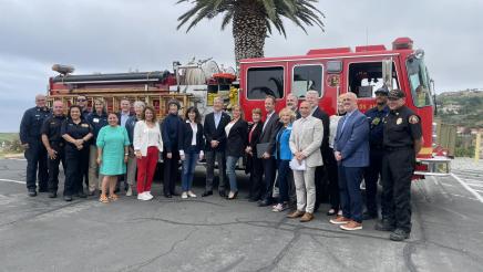 Group photo of Asm. Muratsuchi, guests and first responders in front of fire engine