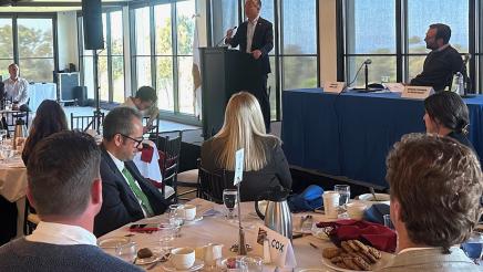 Asm. Muratsuchi speaking on the podium at the event