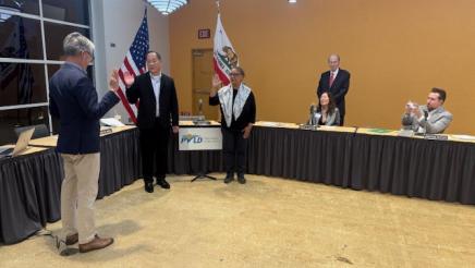 Asm. Muratsuchi swearing in two new members, all with one hand raised
