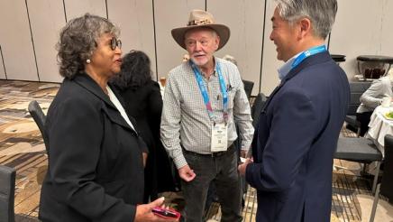 Asm. Muratsuchi speaking with two CSBA members