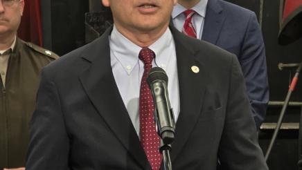 Asm. Muratsuchi at podium, speaking
