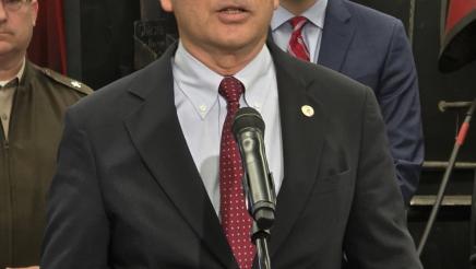 Asm. Muratsuchi at podium, speaking