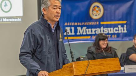Asm. Muratsuchi at podium, speaking