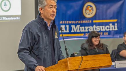 Asm. Muratsuchi at podium, speaking