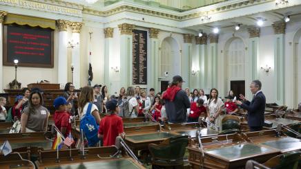 Asm. Muratsuchi on the Assembly Floor speaking to students, teachers and parents