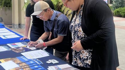 Constituents viewing informational materials on table